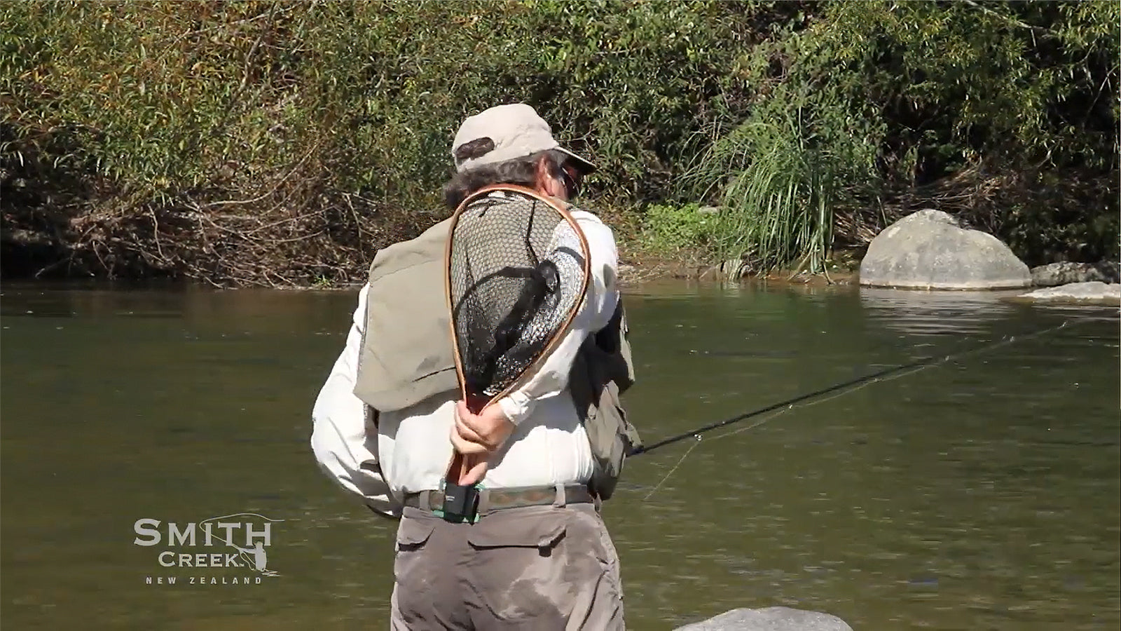 Load video: Smith Creek Net Holster mounted to a wading belt during fly fishing